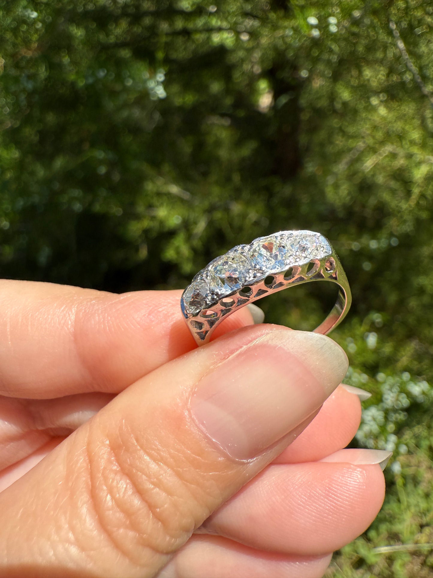 Antique 1.25 Carat Eye Clean Four Stone Old Mine Cut Diamond 18k White Gold French Band