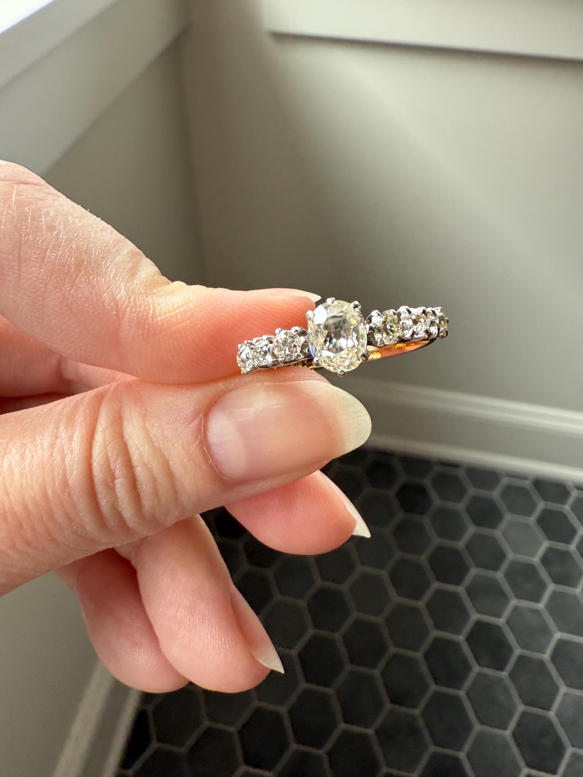 Antique Edwardian Art Deco 1.3 Carat Seven Stone Old Mine Cut Diamond Band Eye Clean Oval Center 18k Gold Platinum Prongs Tall Stacker