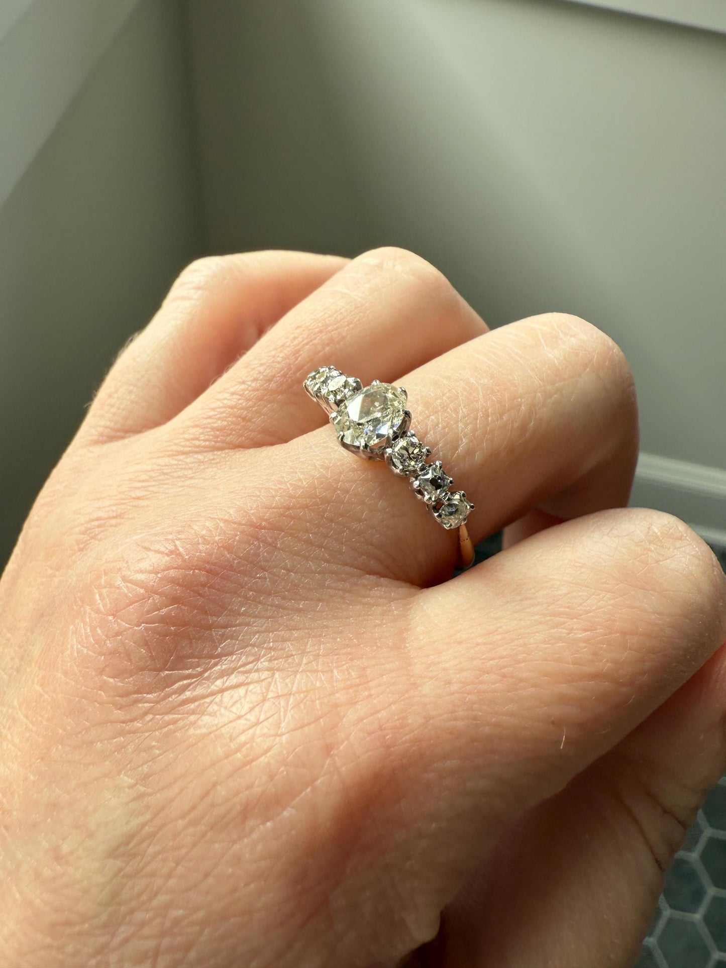 Antique Edwardian Art Deco 1.3 Carat Seven Stone Old Mine Cut Diamond Band Eye Clean Oval Center 18k Gold Platinum Prongs Tall Stacker