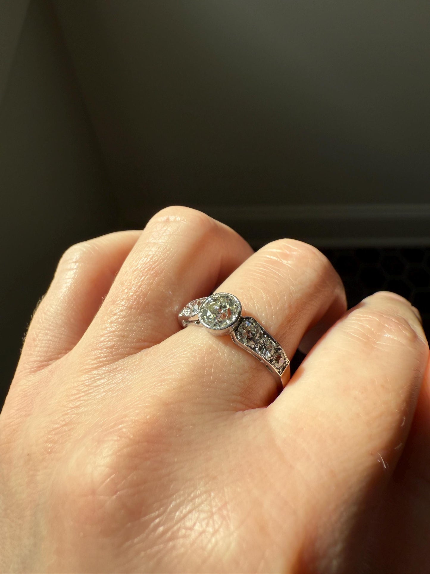 Art Deco Antique Bezel Set Eye Clean 1.85 Carat Tdw Old Mine Cut Diamond Seven Stone Solitaire w/ Accents 18k White Gold & Platinum