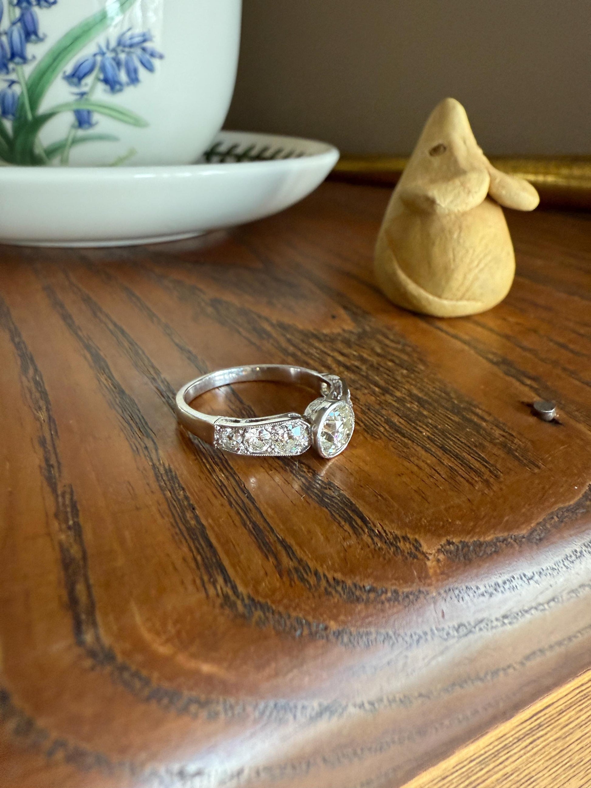 Art Deco Antique Bezel Set Eye Clean 1.85 Carat Tdw Old Mine Cut Diamond Seven Stone Solitaire w/ Accents 18k White Gold & Platinum