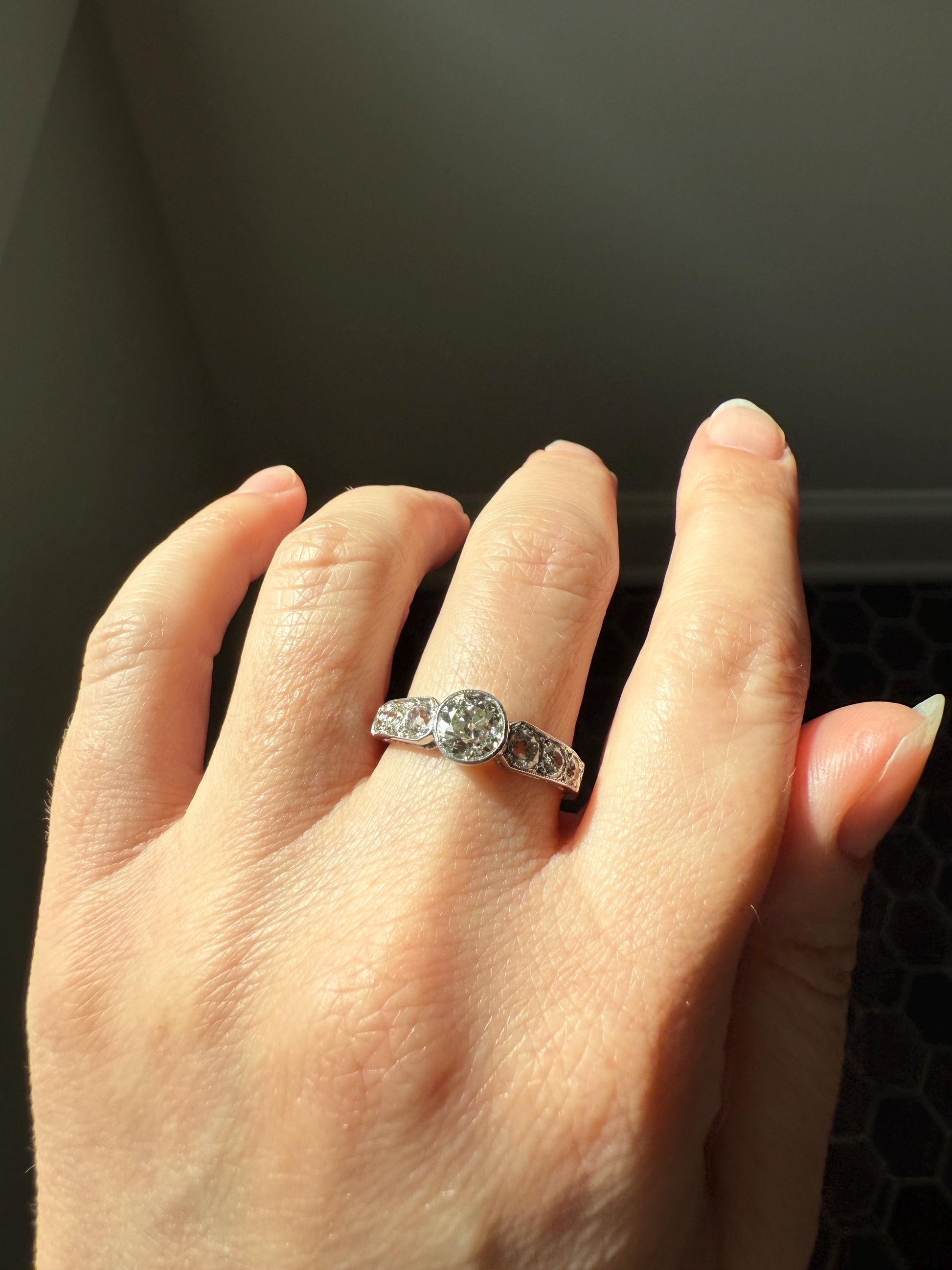 Art Deco Antique Bezel Set Eye Clean 1.85 Carat Tdw Old Mine Cut Diamond Seven Stone Solitaire w/ Accents 18k White Gold & Platinum