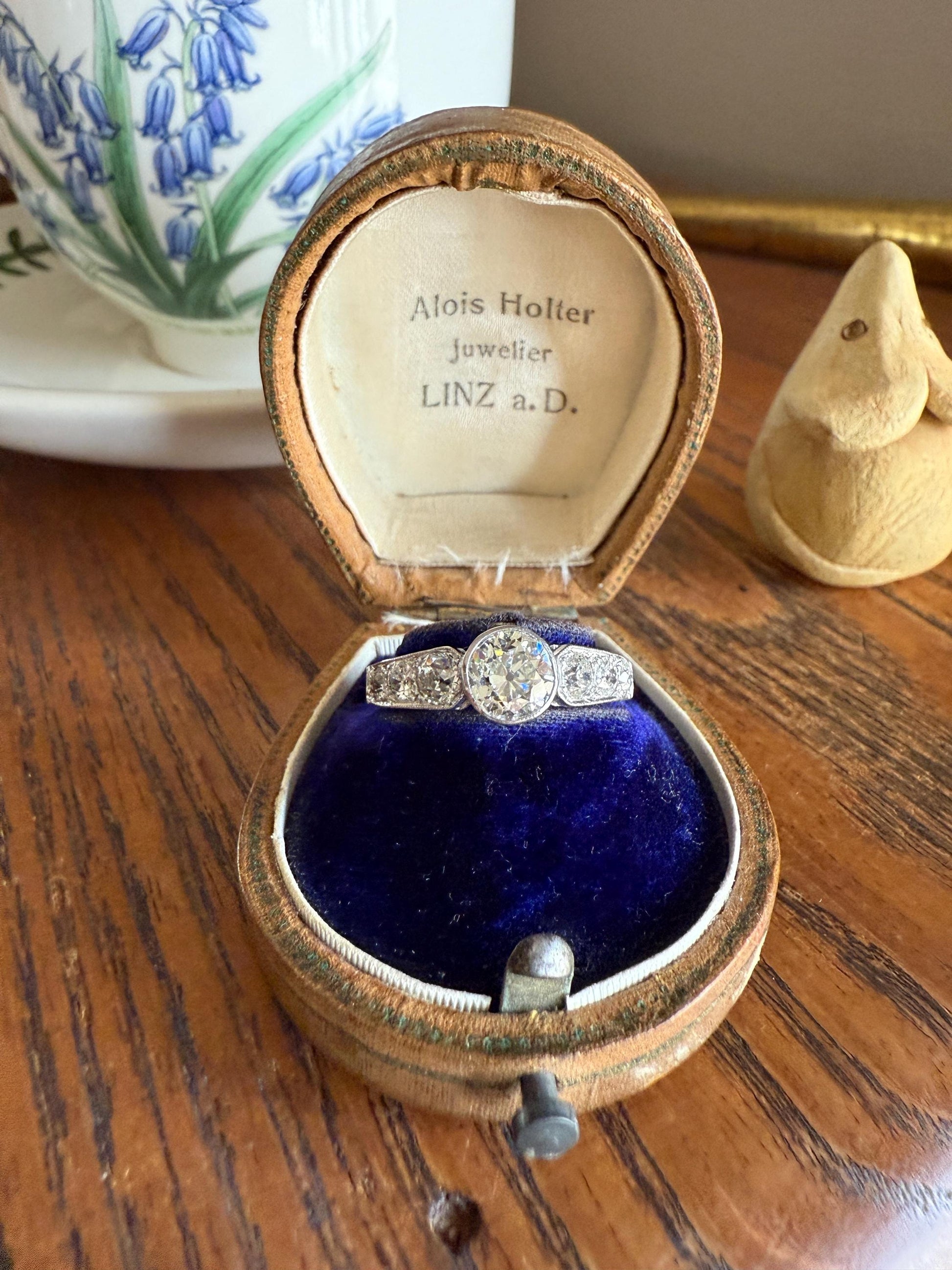 Art Deco Antique Bezel Set Eye Clean 1.85 Carat Tdw Old Mine Cut Diamond Seven Stone Solitaire w/ Accents 18k White Gold & Platinum