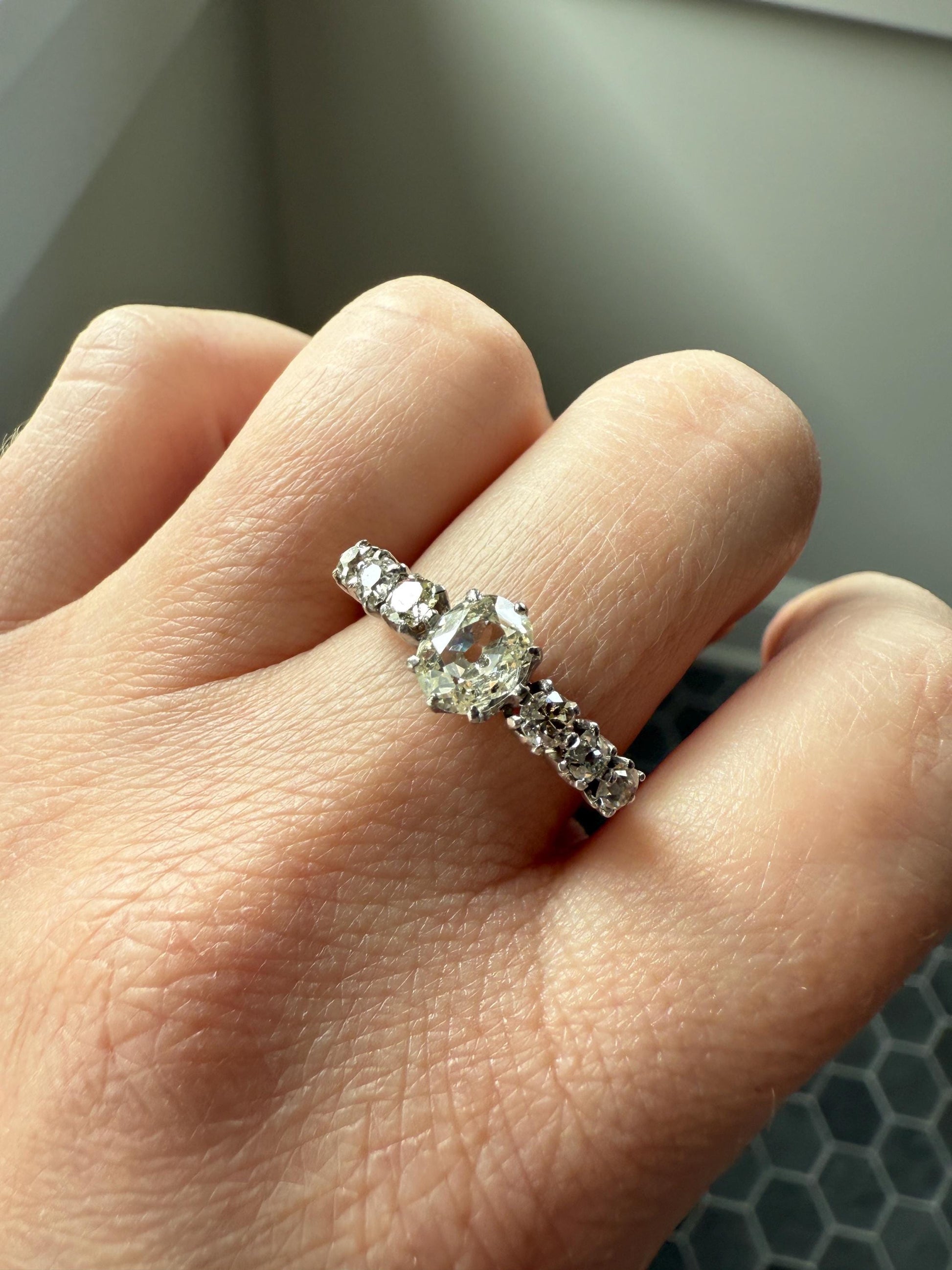 Antique Edwardian Art Deco 1.3 Carat Seven Stone Old Mine Cut Diamond Band Eye Clean Oval Center 18k Gold Platinum Prongs Tall Stacker