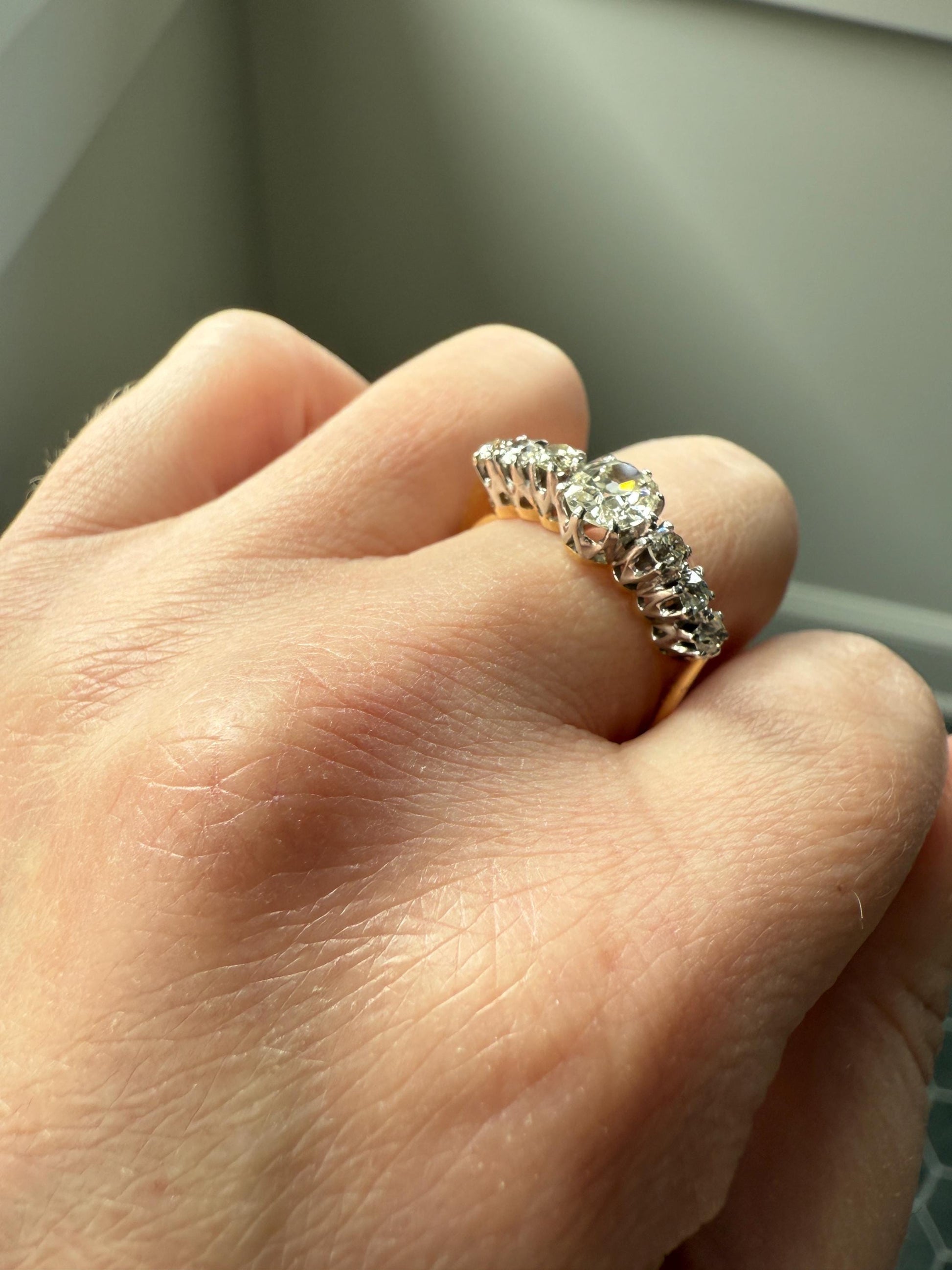 Antique Edwardian Art Deco 1.3 Carat Seven Stone Old Mine Cut Diamond Band Eye Clean Oval Center 18k Gold Platinum Prongs Tall Stacker