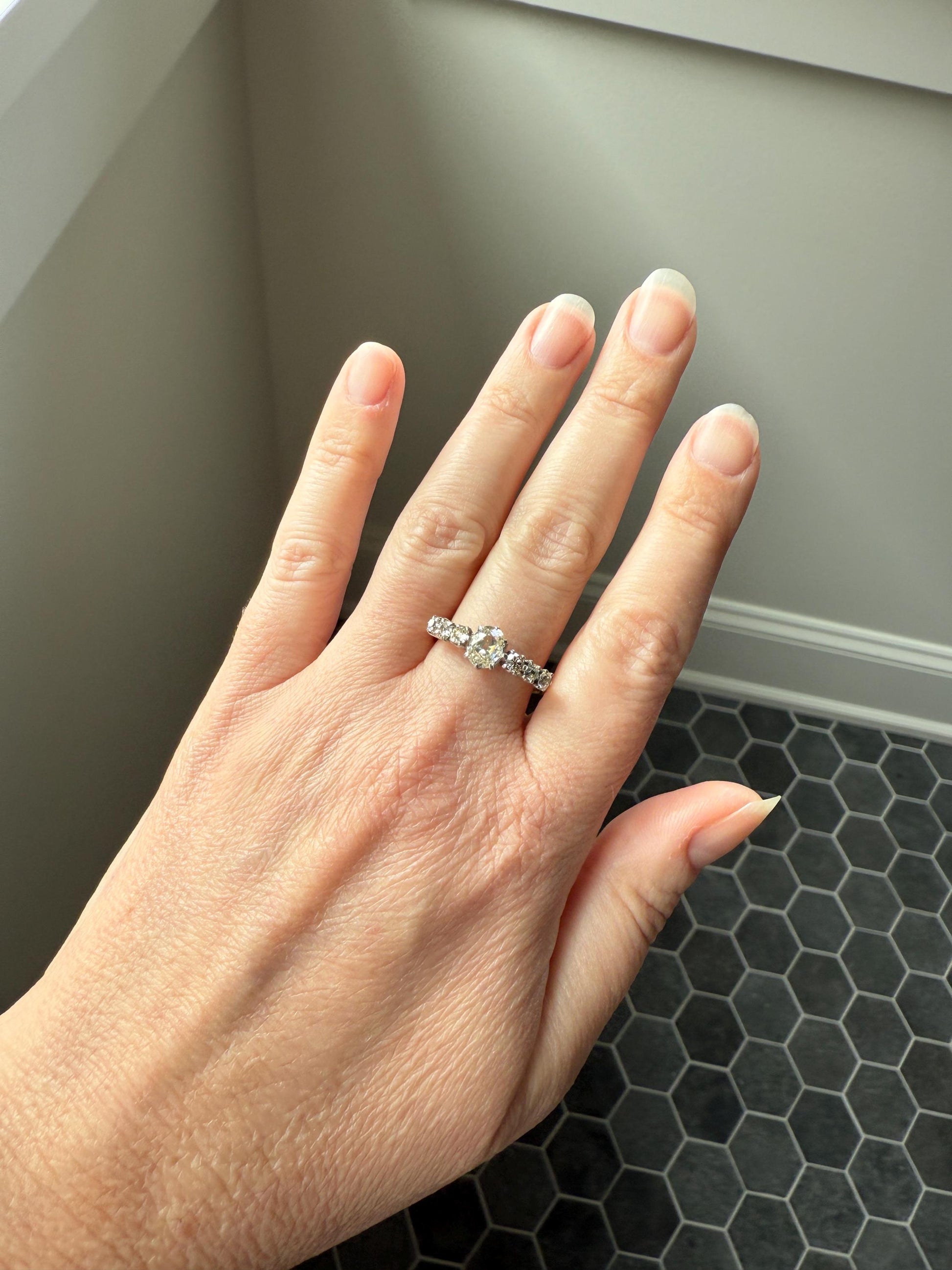 Antique Edwardian Art Deco 1.3 Carat Seven Stone Old Mine Cut Diamond Band Eye Clean Oval Center 18k Gold Platinum Prongs Tall Stacker