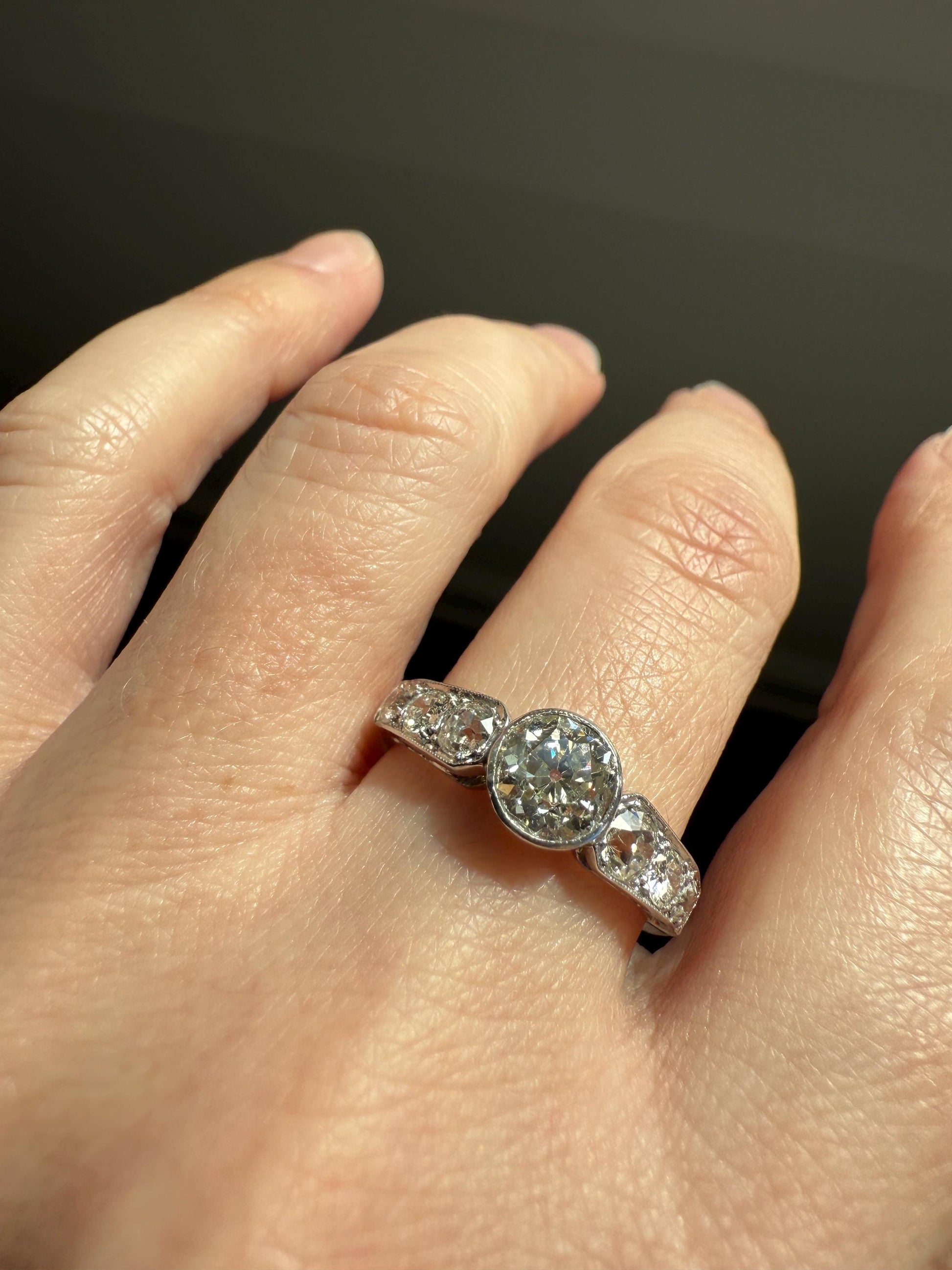 Art Deco Antique Bezel Set Eye Clean 1.85 Carat Tdw Old Mine Cut Diamond Seven Stone Solitaire w/ Accents 18k White Gold & Platinum